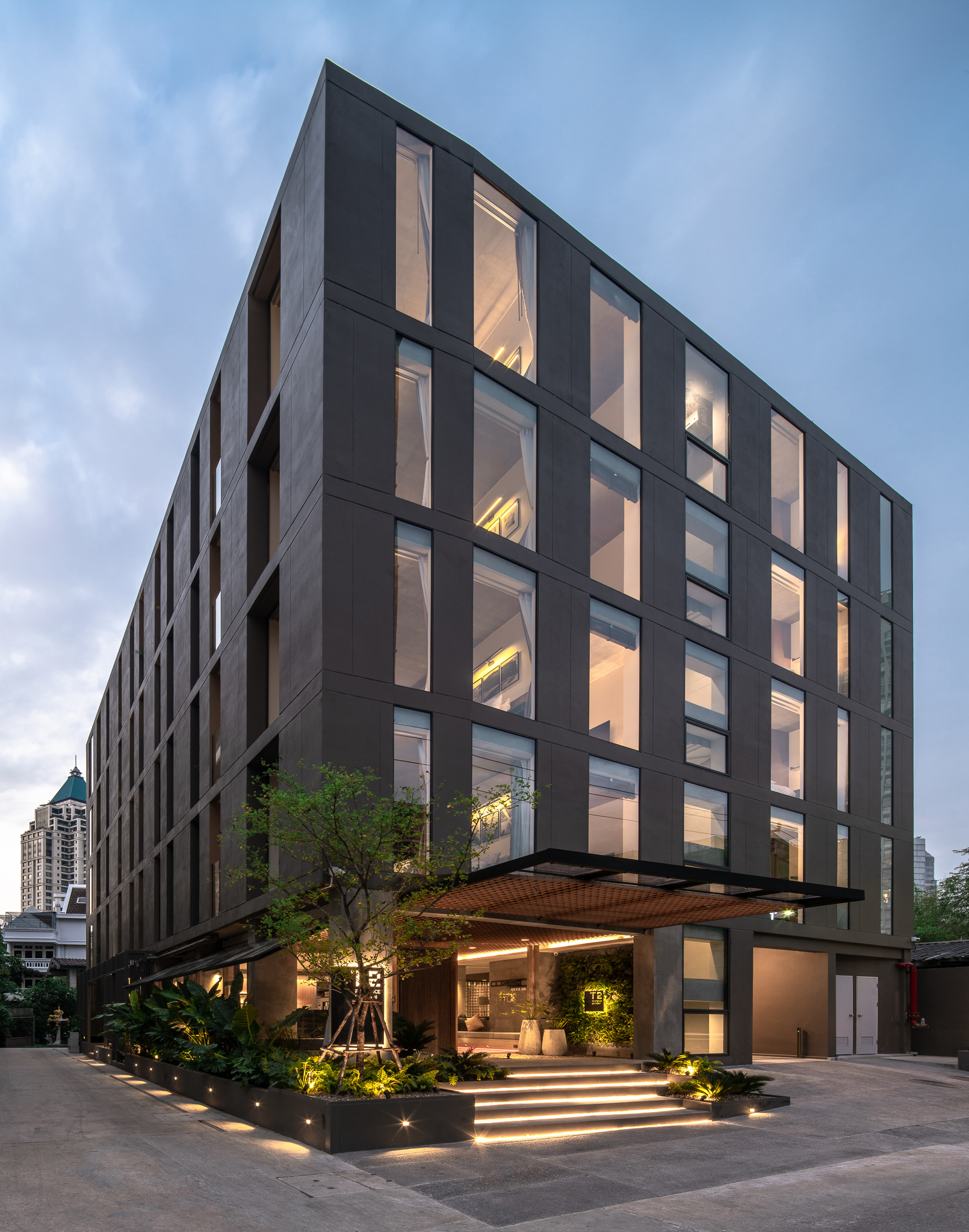 NORMA Hotel Sathorn building exterior at twilight